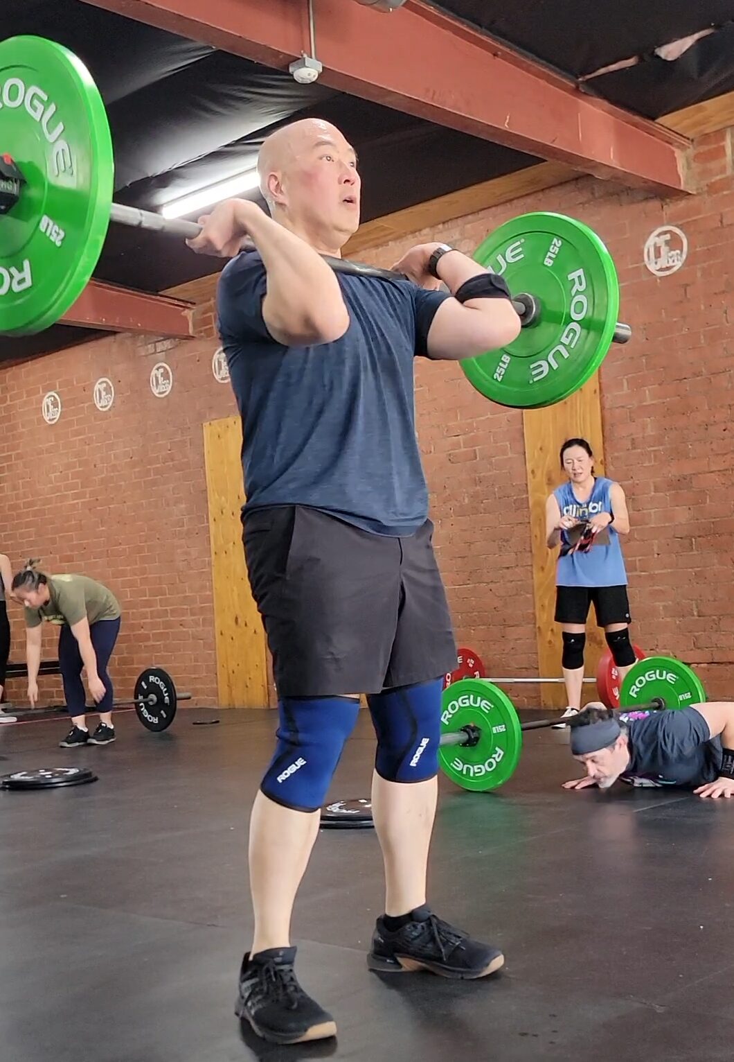 Athlete performing strength training during a CrossFit workout